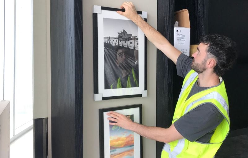 Picture hanging service in action